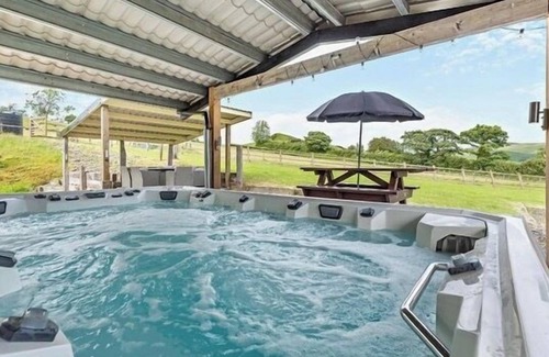 Devils Bridge House | Luxury renovated barn with a large hot tub and disabled friendly. Sleeping 17