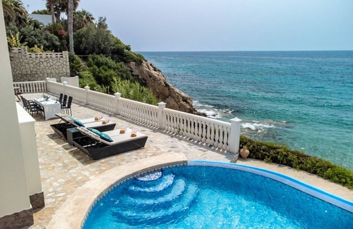 Coveta Fuma House | Luxury villa with its own swimming pool, directly by the sea, stairs to the see.