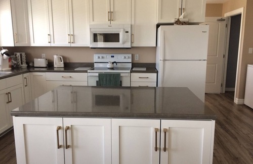 Cheticamp House | Main Floor (Unit 1) in House, Deck, Sunset, Water View (Cheticamp Harbour)
