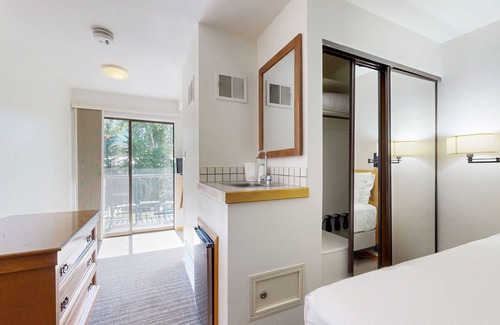 West End Cabin | Main Street studio - pool & hot tub - walk to lifts, dog-friendly, balcony