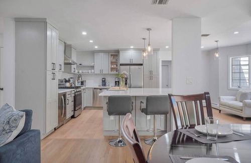 Manorville House | Manorville Escape: Fireplace, Fenced Backyard