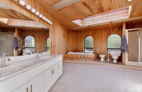 Ladner House | Master bedroom with spacious bathroom