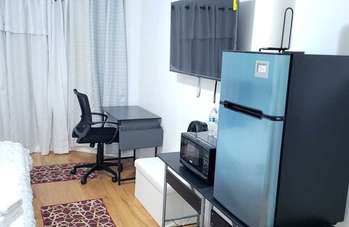 West Side Apartment | Master bedroom with bathroom. With Fridge, Mircowave . 50 Inch LCD, etc.