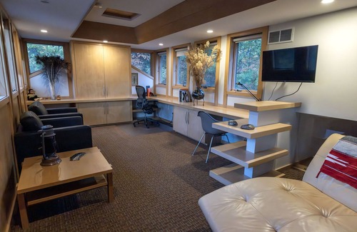 Midland House | Mid-Century Modern Retreat on Private 10 Acres with 1-Acre Pond & Nature Trails.