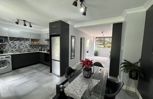 Pretoria Apartment | Modern 4 sleeper private suite and access to beautiful garden and swimming pool