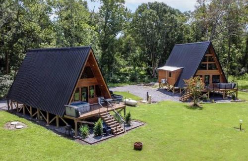 New Iberia Apartment | Modern A-Frame Cabin by Rip Van Winkle with Hot Tub