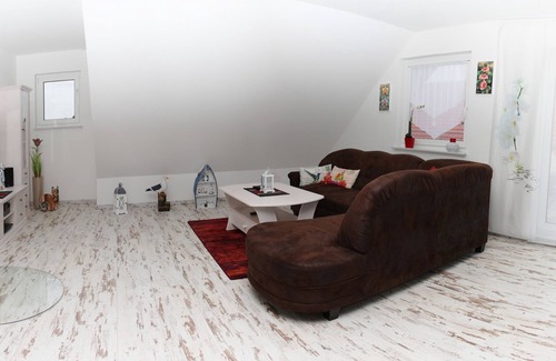 Zempin Apartment | Modern apartment with balcony and fireplace
