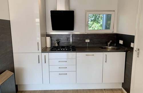 Sint Maartensvlotbrug House | Modern bungalow with veranda, 2 bedrooms, sleeps 4, WiFi, lovely large enclosed garden, dog welcome