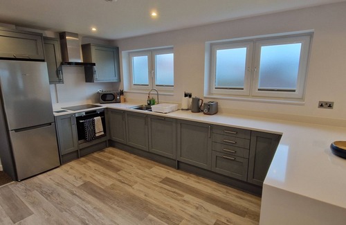 South Side House | Modern bungalow in a quiet lane in Guernsey. Private parking, private garden.