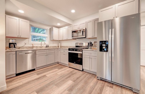 Milford House | Modern Bungalow Retreat: Walk to Arnolds Park, Relax with Fire Pit & Pergola
