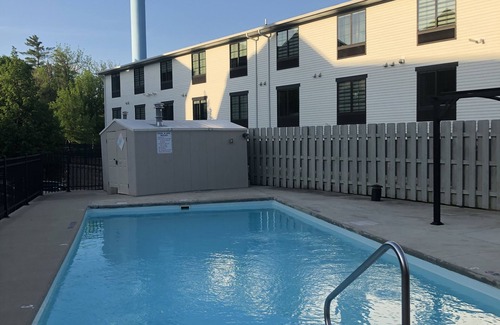 Arnolds Park Condo | Modern clean 2BR/2BA condo with patio & grill, in the heart of Okoboji, IA.