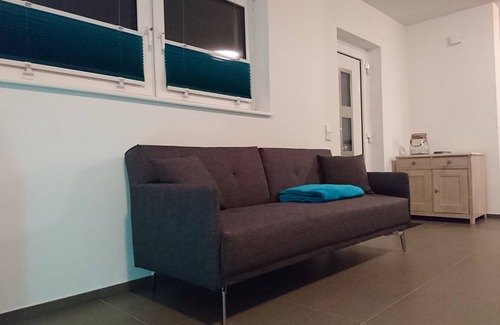 Wollbach Apartment | Modern & comfortable vacation apartment with own entrance, large balcony. Terrace & own PP