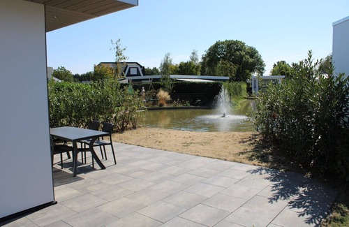 Lathum House | Modern holiday home with a view of a tranquil pond