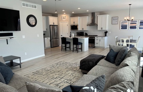 Milliken House | Modern home with a large fenced yard, and garage access