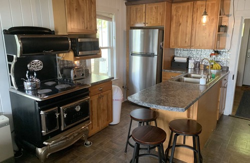 Oakland Cottage | Modern Lakefront Camp on East Pond - cozy fire pit, 3 kayaks, canoe
