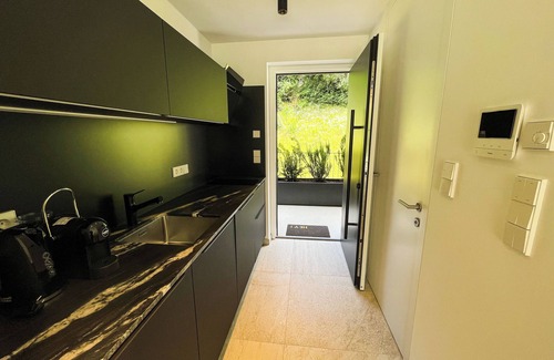 Sant'Andrea in Monte Apartment | modern, luxury, private entrance, garden, terrace, and stunning mountain views.