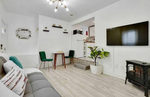 Prospect Park Apartment | Modern, Quiet Apt 30 min to NYC with Workspace, Private Patio & Parking.