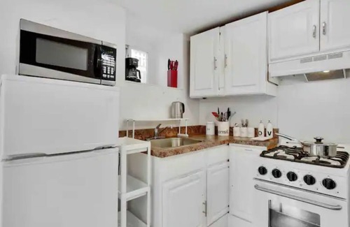 Prospect Park Apartment | Modern, Quiet Apt 30 min to NYC with Workspace, Private Patio & Parking.