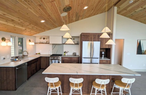 Hamma Hamma House | Modern retreat with serene canal, forest, and mountain views.