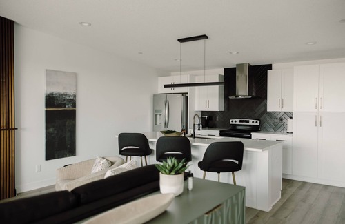 Des Moines House | Modern Townhome with Skyline Views, Heated Balcony & Curated Art in Downtown DSM