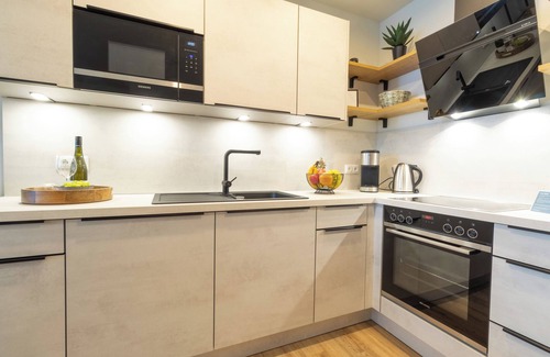 Dorumer Neufeld Apartment | Moderne Ferienwohnung mit Balkon und Sauna in Strandnähe