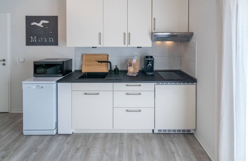 Norddeich Apartment | Moderne Ferienwohnung in Direkter Deichlage in Norddeich. 2 Personen + Kleinkind