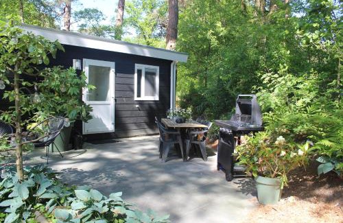 Diever Apartment | Mooi 4p Wellness chalet in het Bos met finse Sauna en Hottub