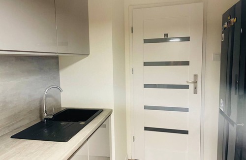 Bialoleka Apartment | MyCondo Fashion District apartment with garage