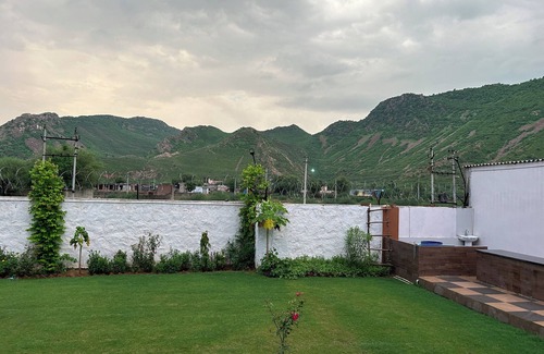 Alwar Other | Nestled amidst majestic mountains, our farmhouse offers a serene and picturesque