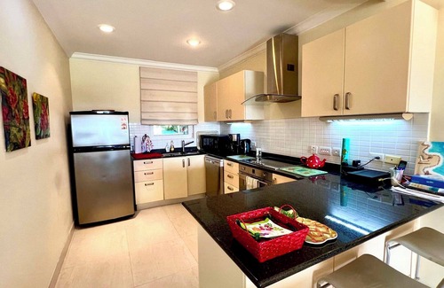 Callendar Condo | Nestled on the prestigious Barbados Golf Course, this charming two-bedroom called “Island Time”