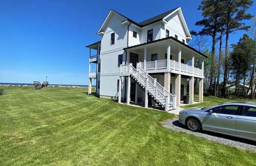 Gwynn House | New 5 bedroom home on private, sandy beach with game room and elevator.