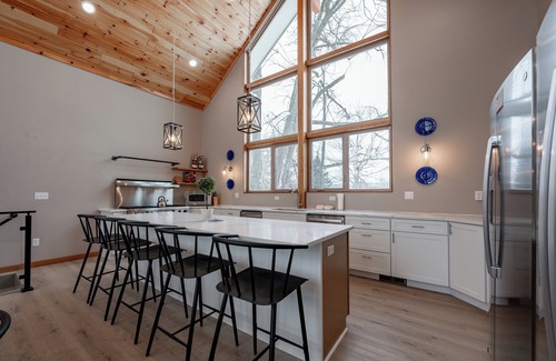 Waterfront Greens House | New! Discover Serendipity: Lake Front, Dogs Ok, Pool, Hot Tub!