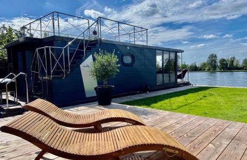 Baambrugse Zuwe Boat Rental | NEW - Little Asia - Stunning Boathouse on a lake Near Amsterdam with Sauna
