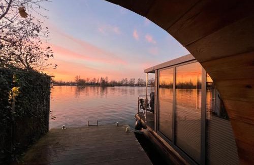Baambrugse Zuwe Boat Rental | NEW - Little Asia - Stunning Boathouse on a lake Near Amsterdam with Sauna