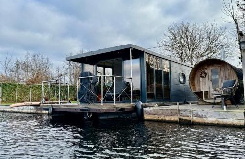 Baambrugse Zuwe Boat Rental | NEW - Little Asia - Stunning Boathouse on a lake Near Amsterdam with Sauna