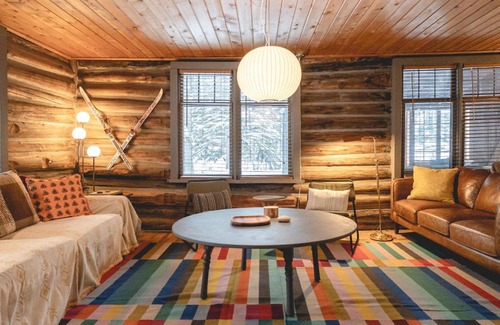 Alanson House | NEW! Log cabin retreat with modern updates sleeps 14