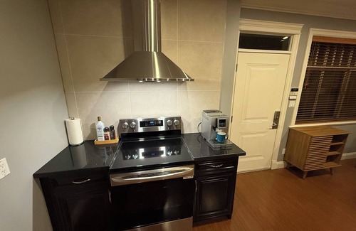 Arbutus Ridge House | Newly furnished King-bed Room1, shared bath and common space