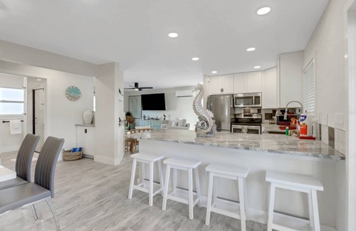 Mid Island House | Newly Remodeled, Lovely 1st Floor Apartment! Walk to Beach! Over $150 Free Daily Activities!