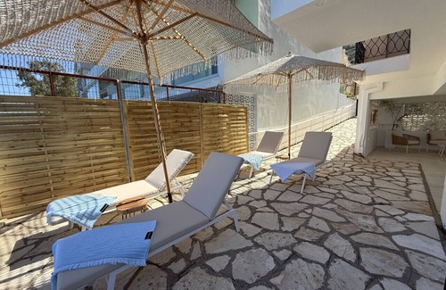 Benitses Apartment | Newly renovated luxury apartment on the beach with large sea front patio