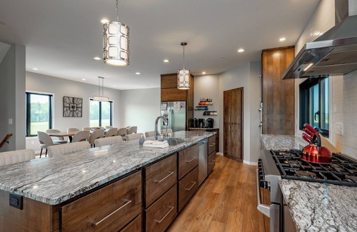 Waterfront Greens House | Night & Day: Lake Access, Hot Tub!