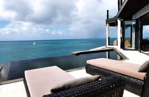 Fryes Beach Villa | Ocean front modern three bedroom apartment in e spectacular resort