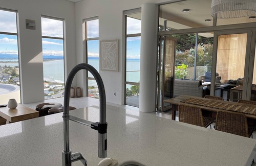 Sumner House | Ocean-view escape: 4 bedrooms, heated pool, sauna, and expansive terraces