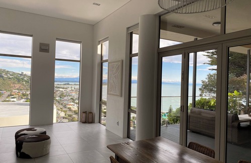 Sumner House | Ocean-view escape: 4 bedrooms, heated pool, sauna, and expansive terraces