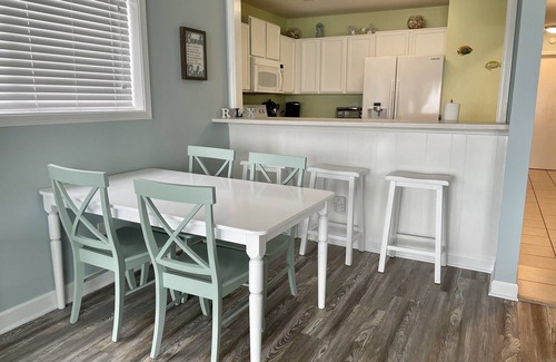 Kure Beach Condo | Oceanfront Ground Floor Condo with Pool- Riggings D1