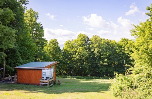 Town of Broome Cabin | Off-Grid, Buck Tiny House with Indoor Soaking Tub & Mountain Top Views