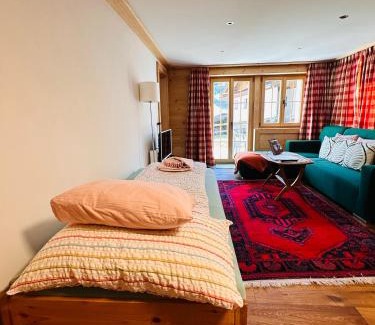 Zweisimmen House | One Bedroom with mountain and garden view ground floor of Chalet Solaria