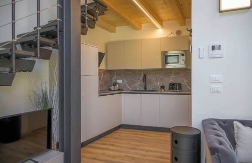 Crociale Apartment | Open space on two floors in detached cottage in ancient medieval courtyard