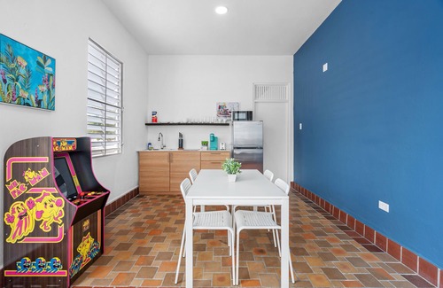 Sagrado Corazon Apartment | Otium Rentals Plush King Bed Pacman Arcade