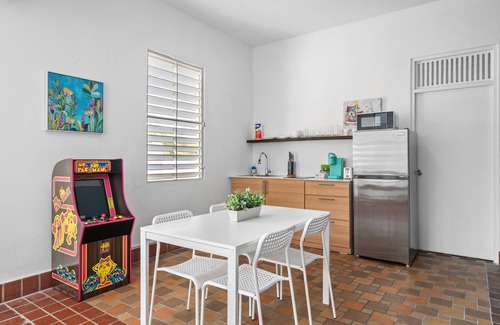 Sagrado Corazon Apartment | Otium Rentals Plush King Bed Pacman Arcade