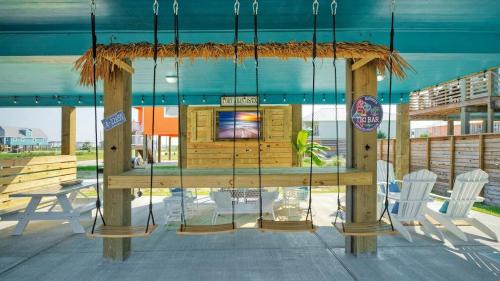 Cinnamon Shore House | Outdoor Lounge w Bar Swing Seats Near Nature Preserve Blutopia by AvantStay